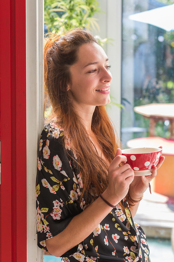 Woman drinking hot beverage