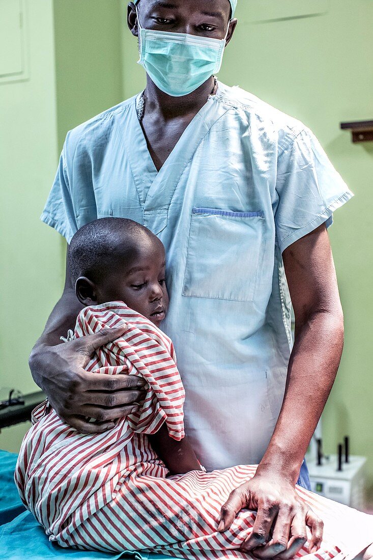 Surgeon with child awaiting surgery