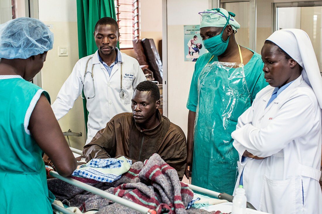 Father with sick child and surgical team