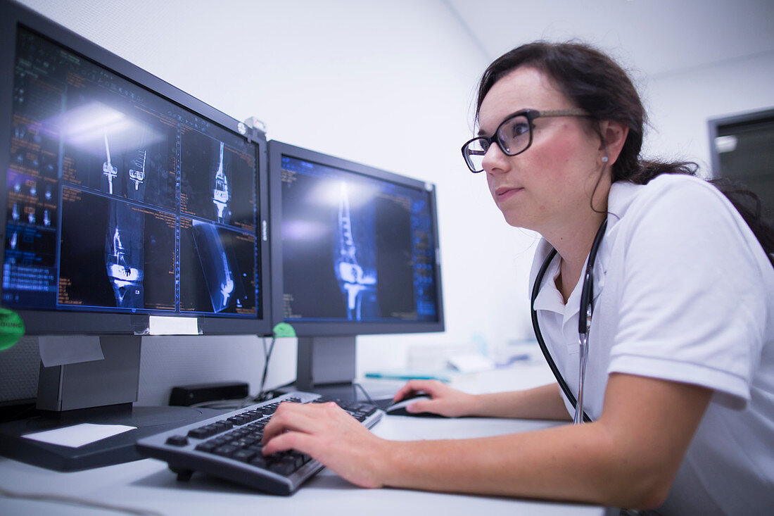 Radiologist studying scans