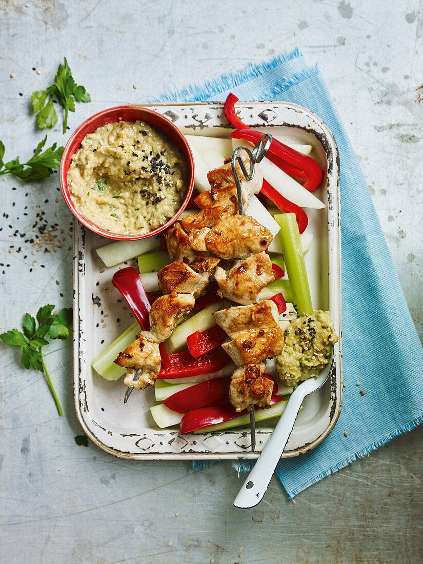 Chicken skewers with parsley hummus and fresh vegetables