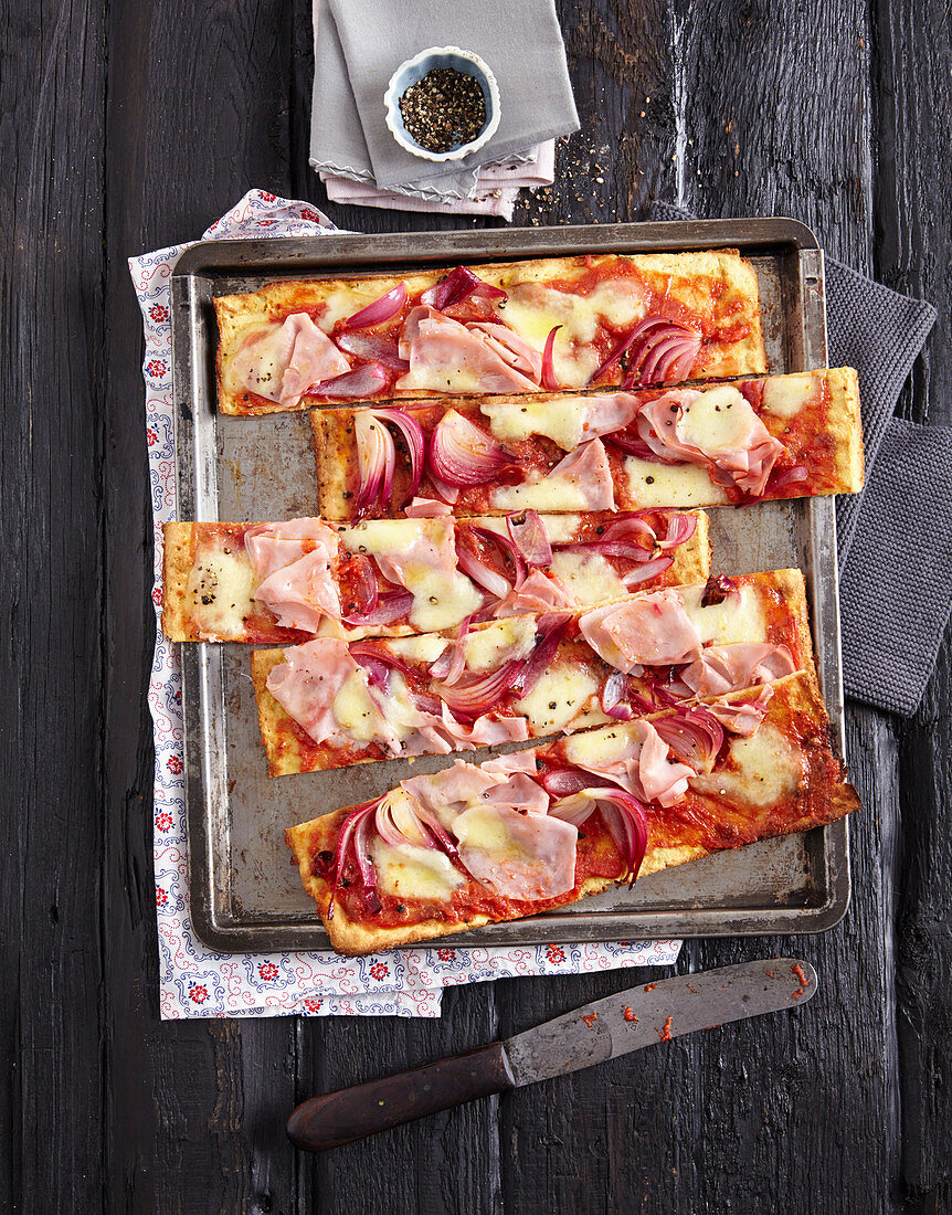 Mozzarella and almond tray bake pizza with onions, ham and cheese