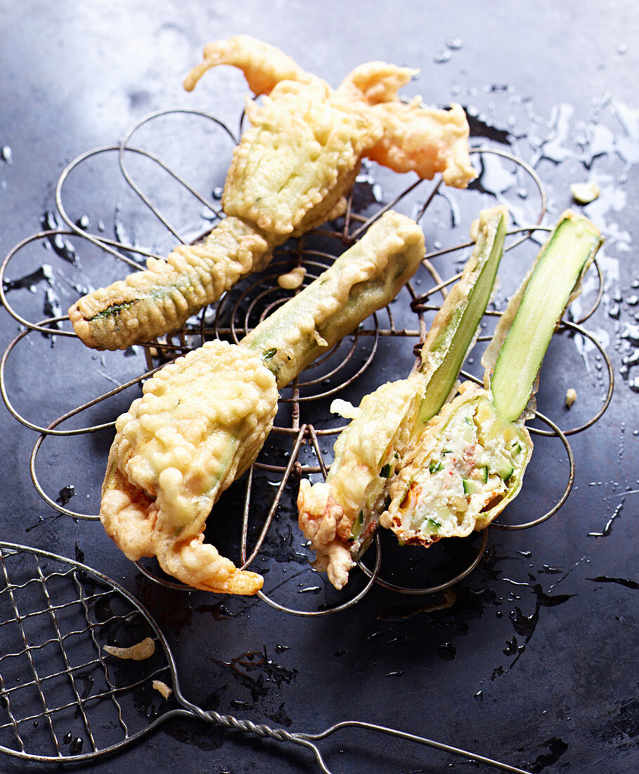 Stuffed, battered courgette flowers