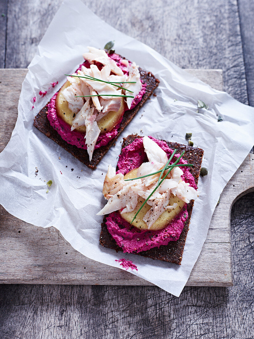 Beetroot cream with smoked trout on pumpernickel bread