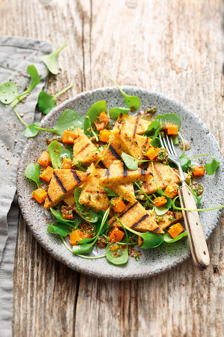 Grilled hazelnut polenta with a sweet potato and purslane salad