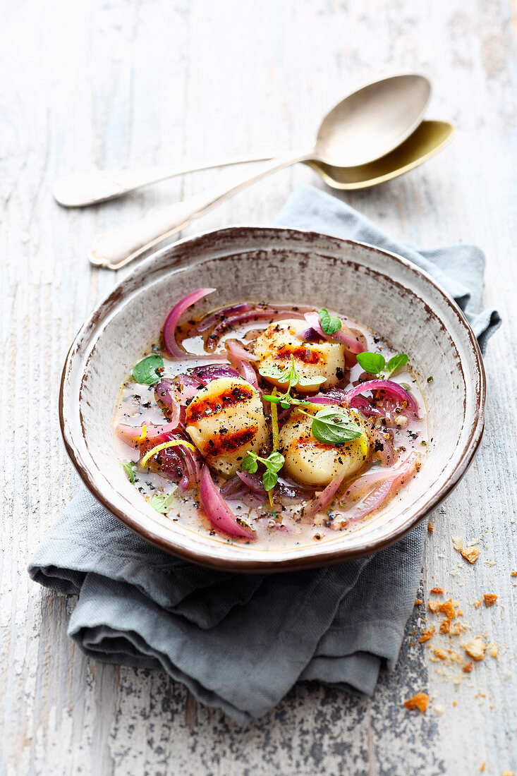 Onion soup with grilled scallops