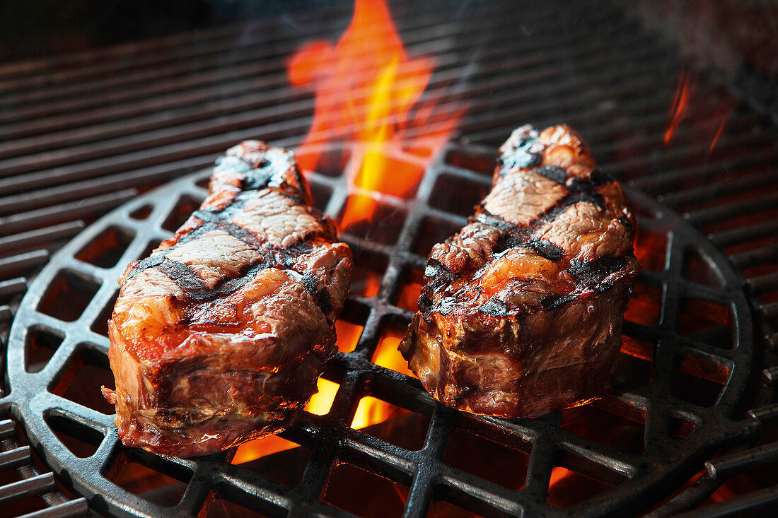 Ribeye steaks on a grill