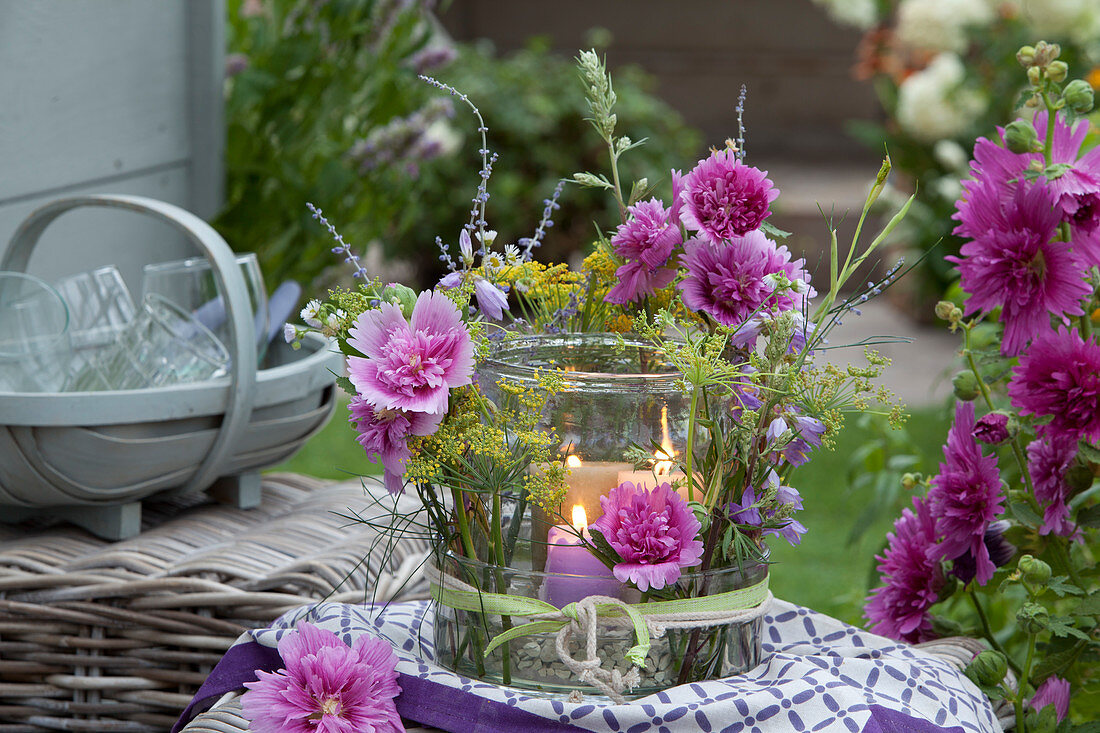 Lantern in glass bowl with hollyhocks, bluebells, fennel and honorary prize