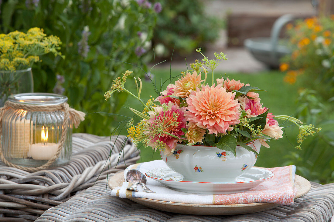 Bouquet of dahlias and fennel in gravy boat