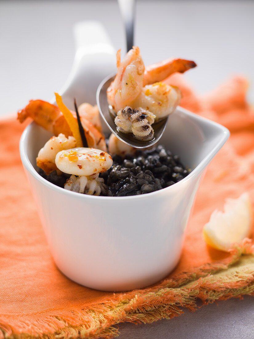 Black risotto with shrimps and squid