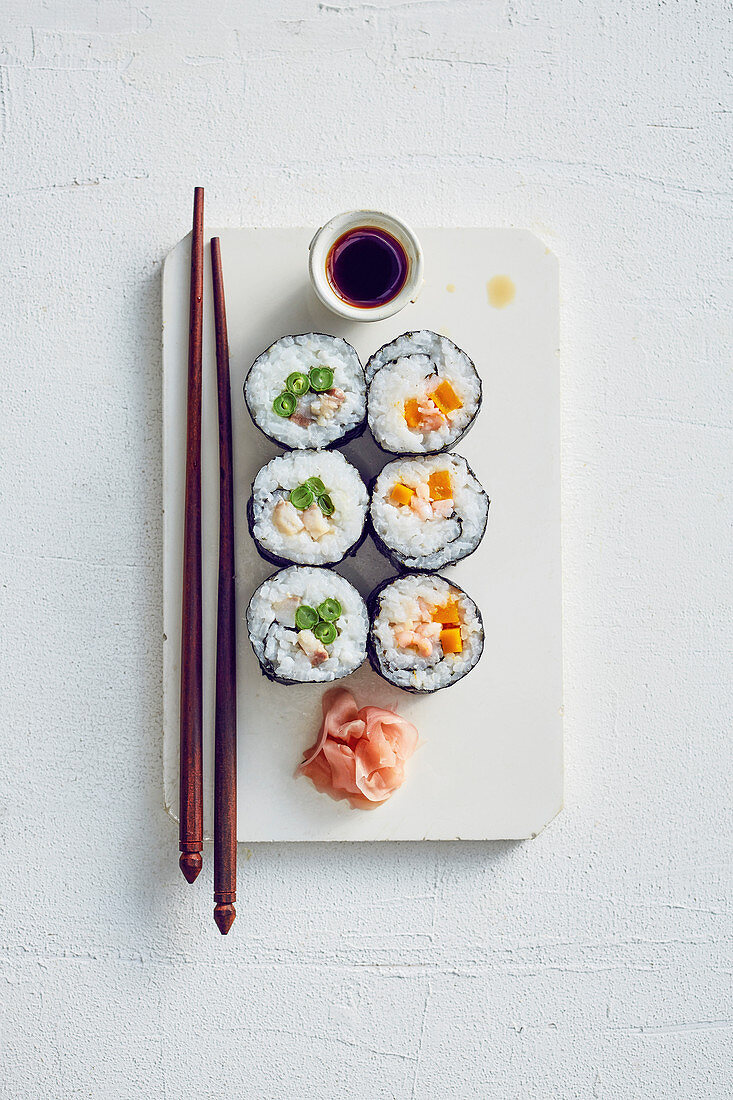 Soused herring and prawn sushi with pumpkin and beans