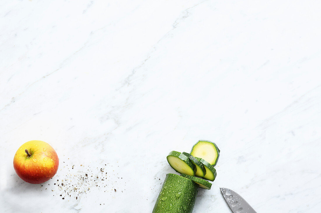 An apple and a slice courgette