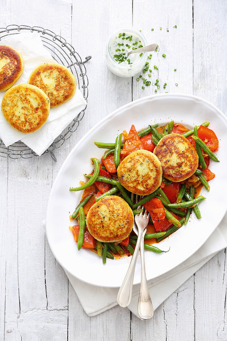 Jerusalem artichoke fritters on a pepper and bean medley