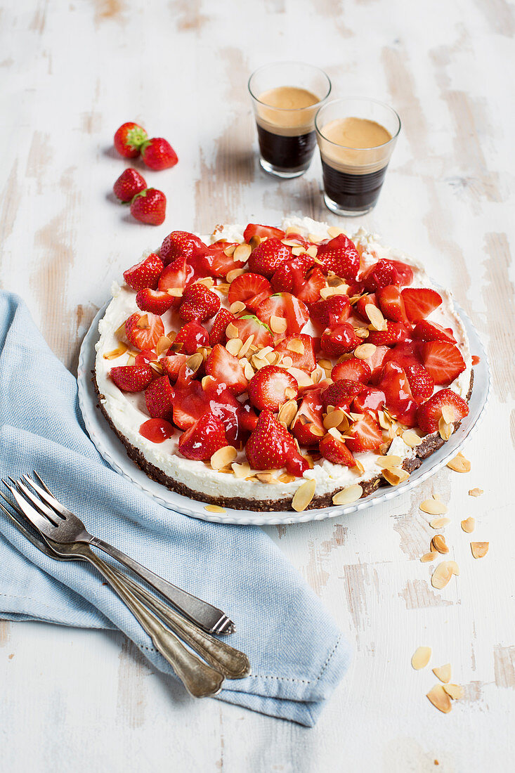 Chocolate and strawberry cheesecake with flaked almonds