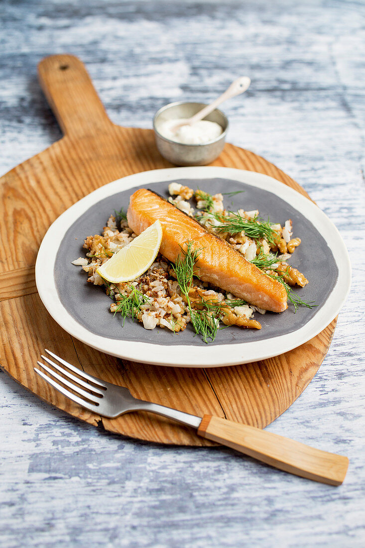 Salmon with cauliflower couscous and sesame seed sauce