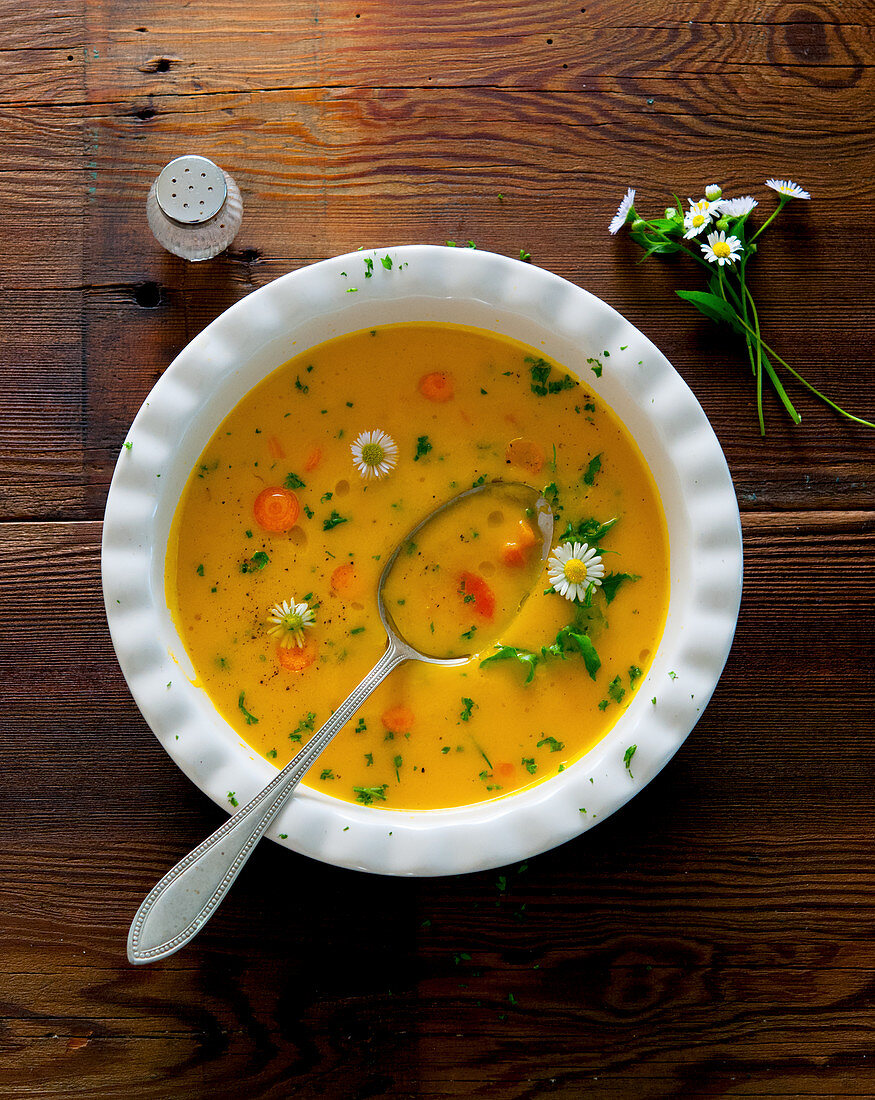 Carrot soup with garden herbs