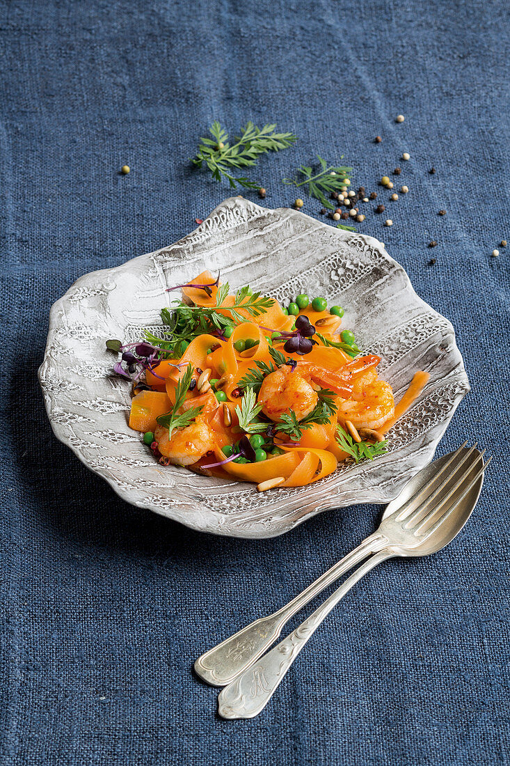 Prawns with carrot tagliatelle and peas