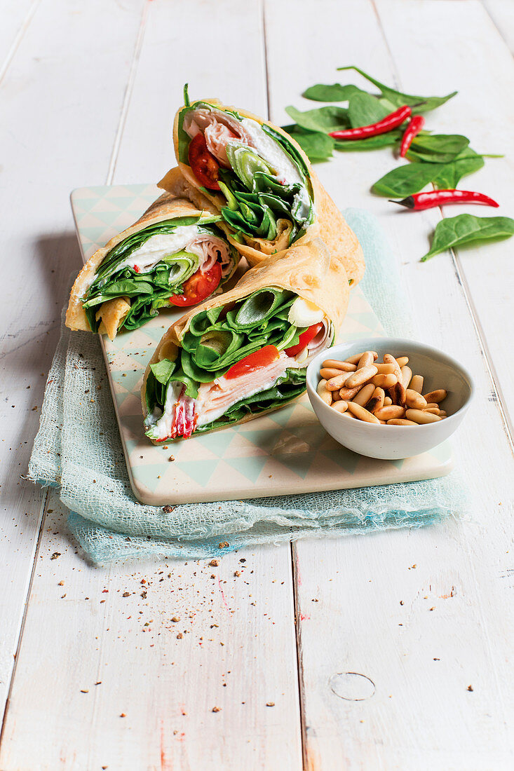 Turkey and spinach wraps with ricotta and pine nuts