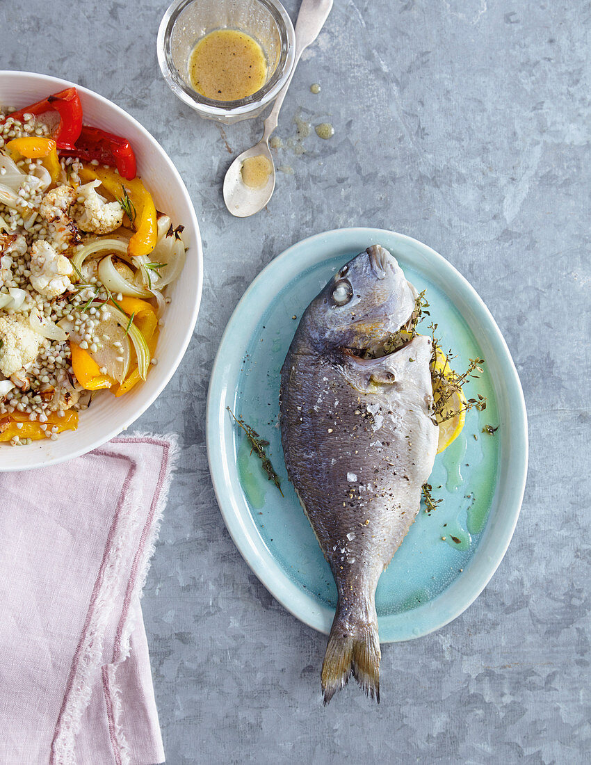 Baked dorade with vegetable salad