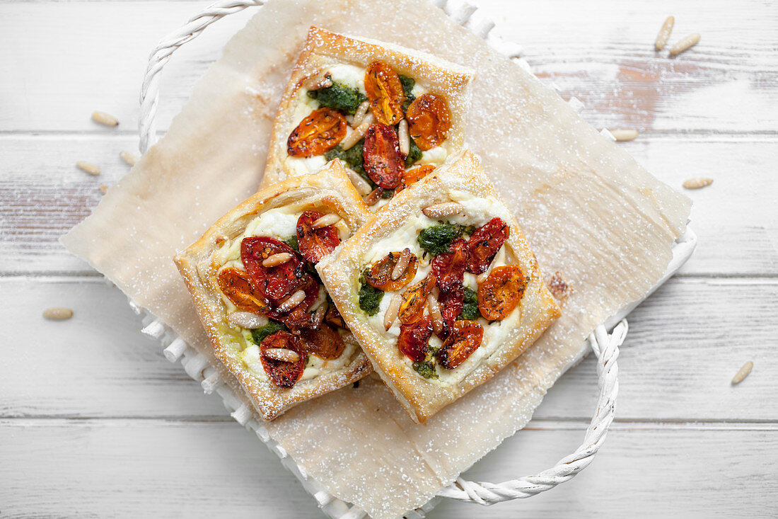 Savory pastry with goat cheese, half dried tomatoes, spinach and pine nuts