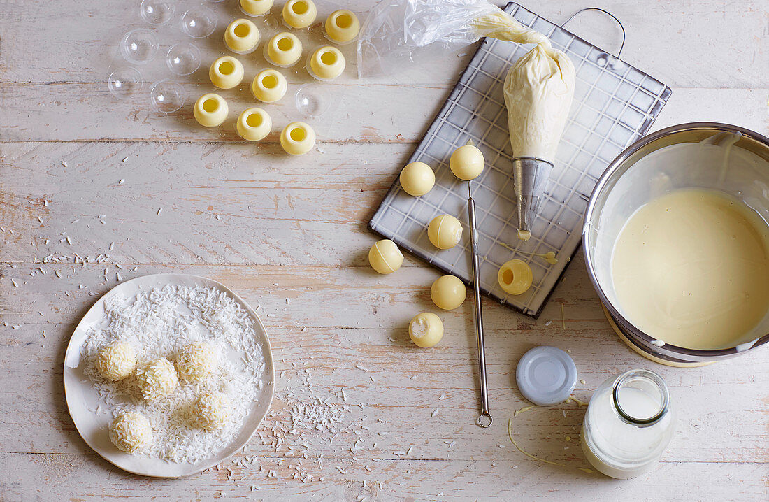 Filled, white chocolate truffles being made