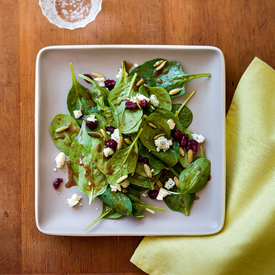 Spinach salad with gorgonzola, pine nuts and pomegranate seeds