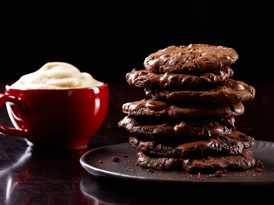 Stack of chocolate cookies and espresso