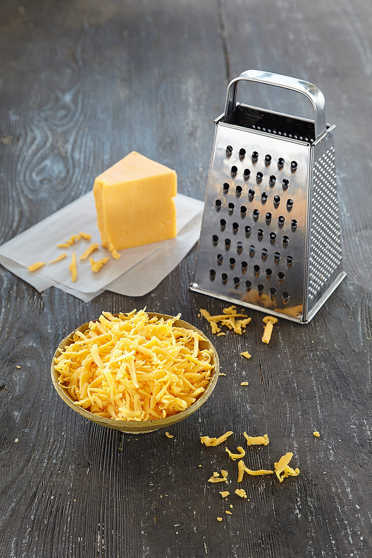 Grated Cheddar cheese for fondue