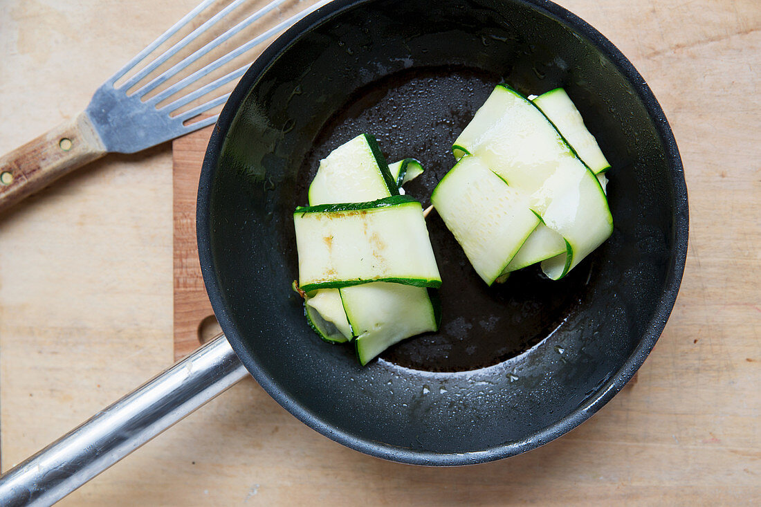 Courgette parcels being fried