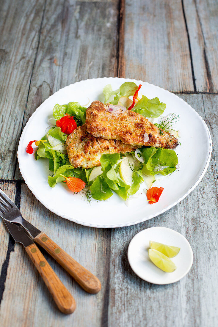 Oven-baked fish with salad