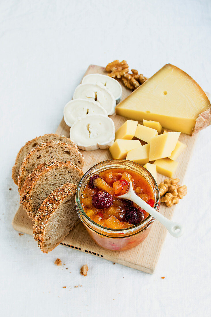 Apple chutney with cranberries with various types of cheese