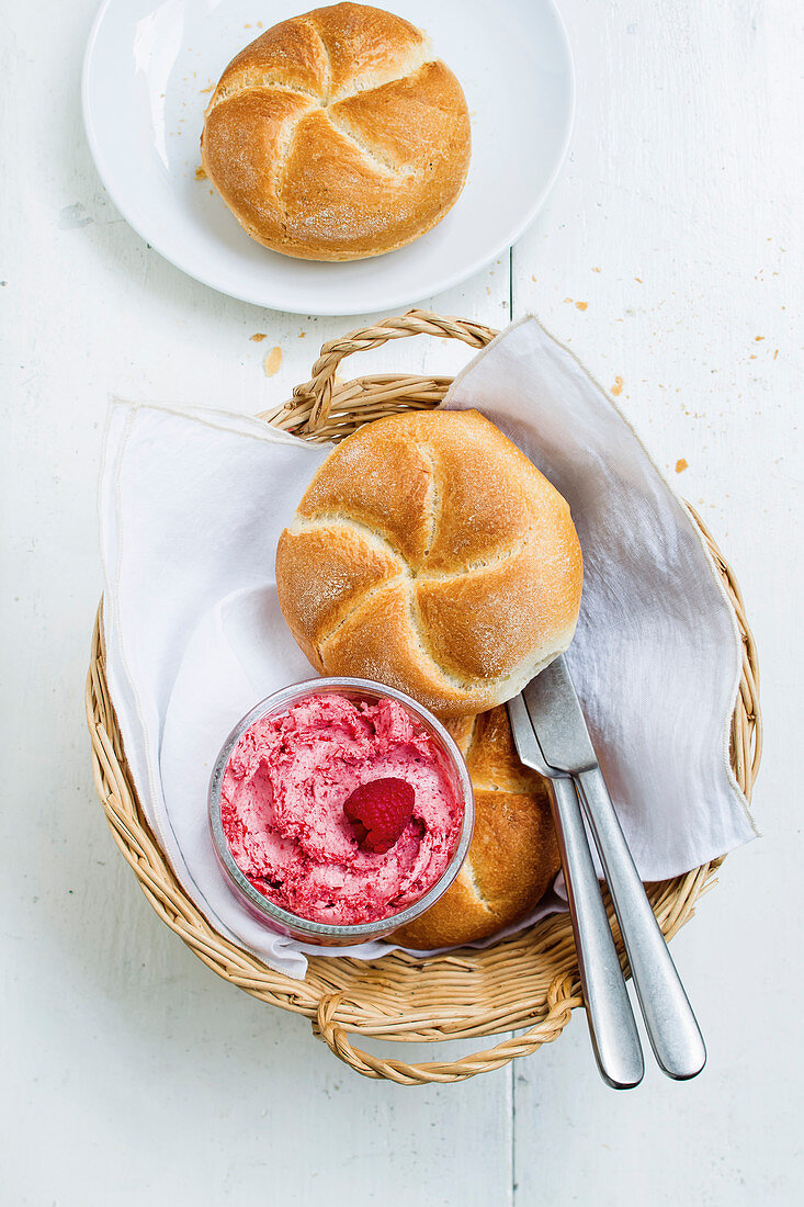 Sweet raspberry butter with bread rolls