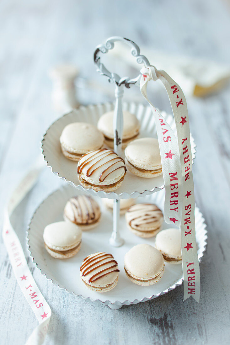 Gingerbread macaroons on a cake stand