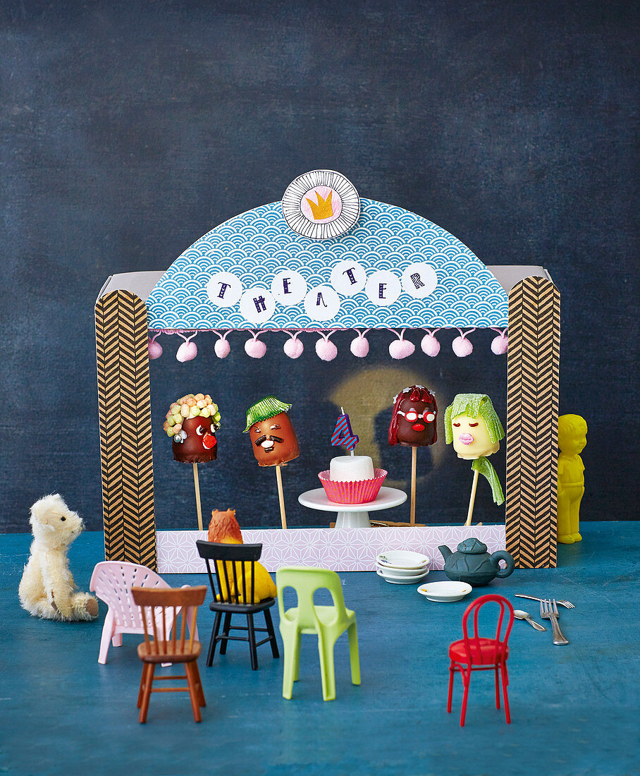 A puppet theatre with chocolate marshmallow faces