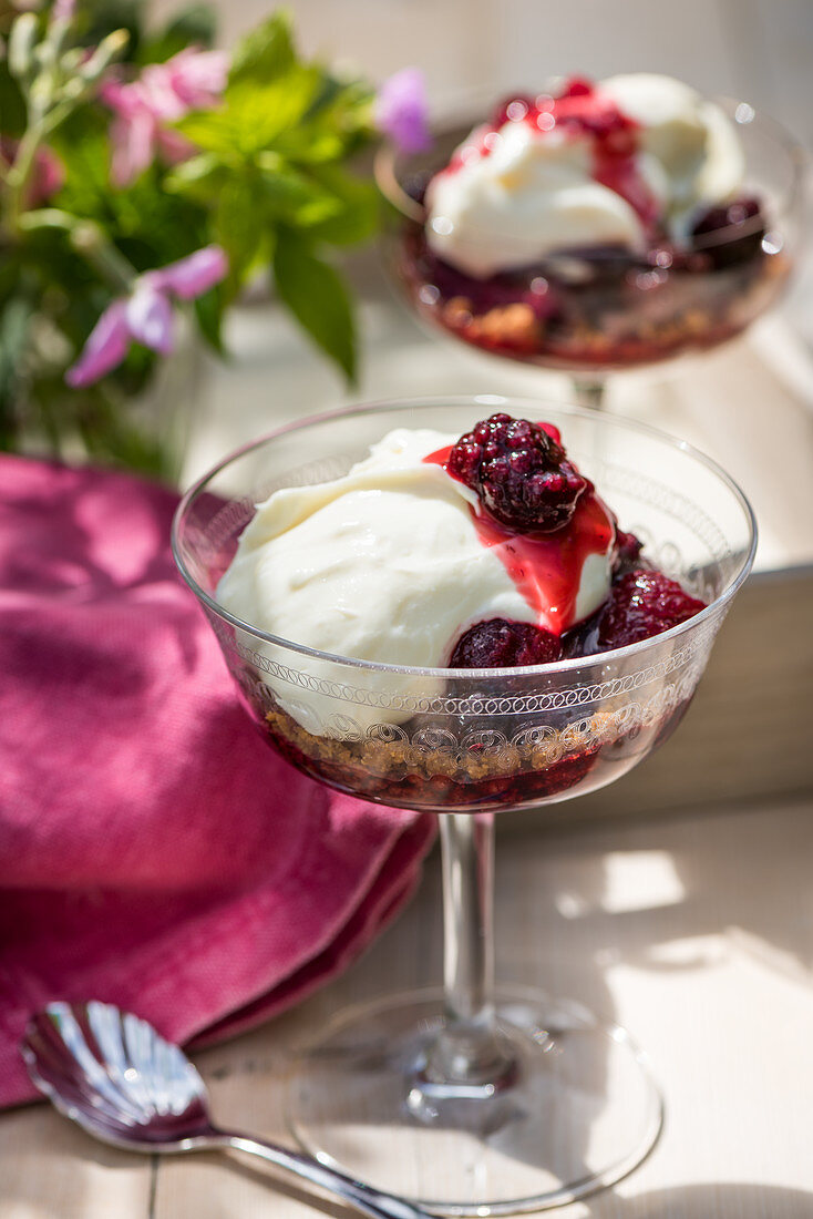 Cheesecake with berry compote in a glass