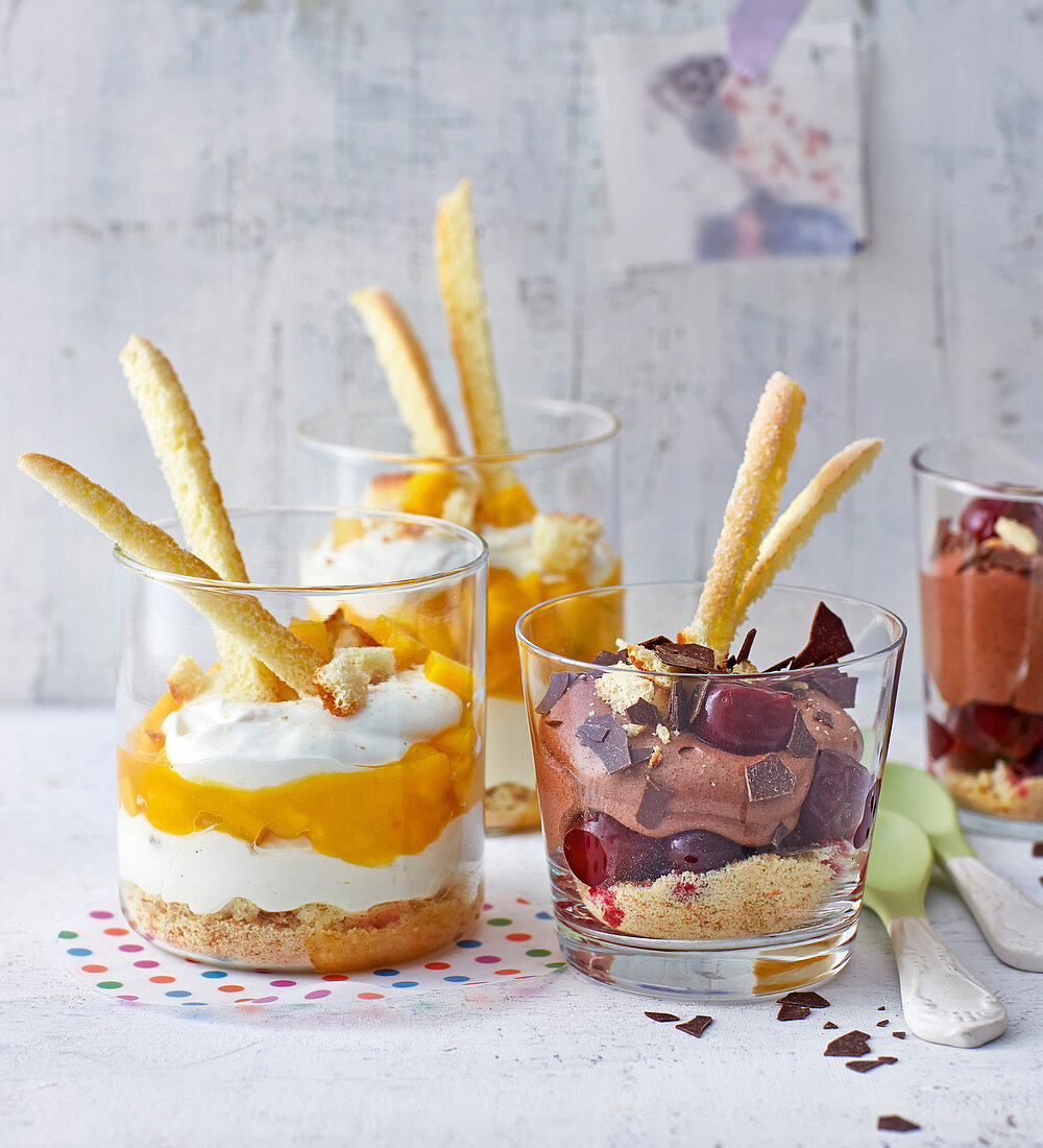 Mango and chocolate layered desserts in glasses