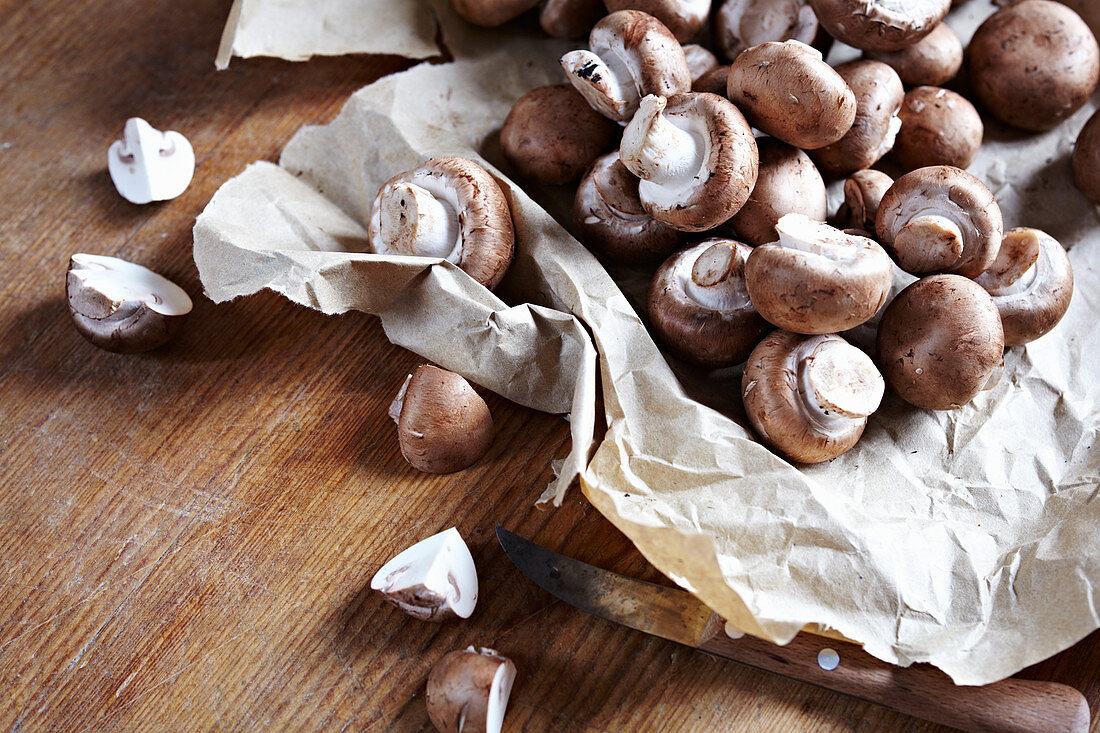 Fresh button mushrooms on paper