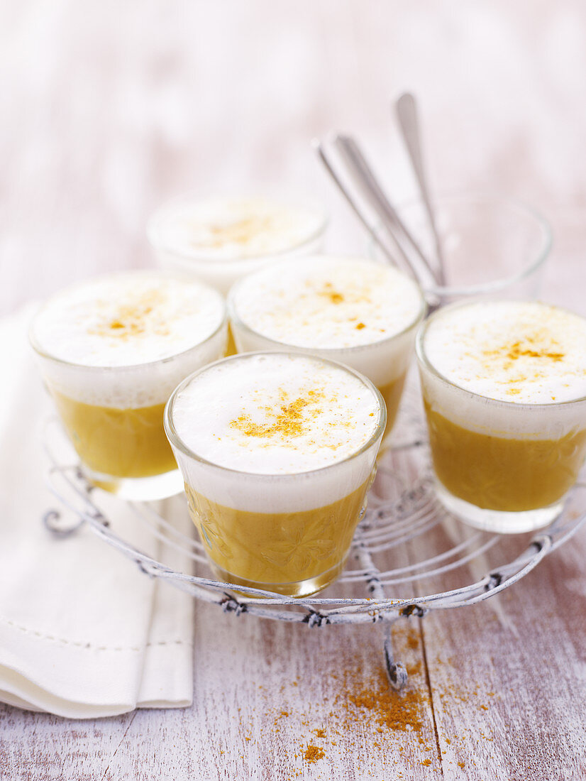 Coconut and curry soup served in glasses