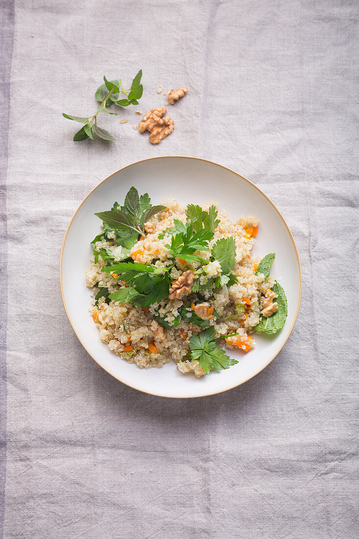 Herb salad with quinoa and walnuts