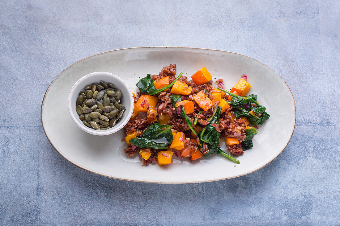 Red rice with a pumpkin and spinach medley