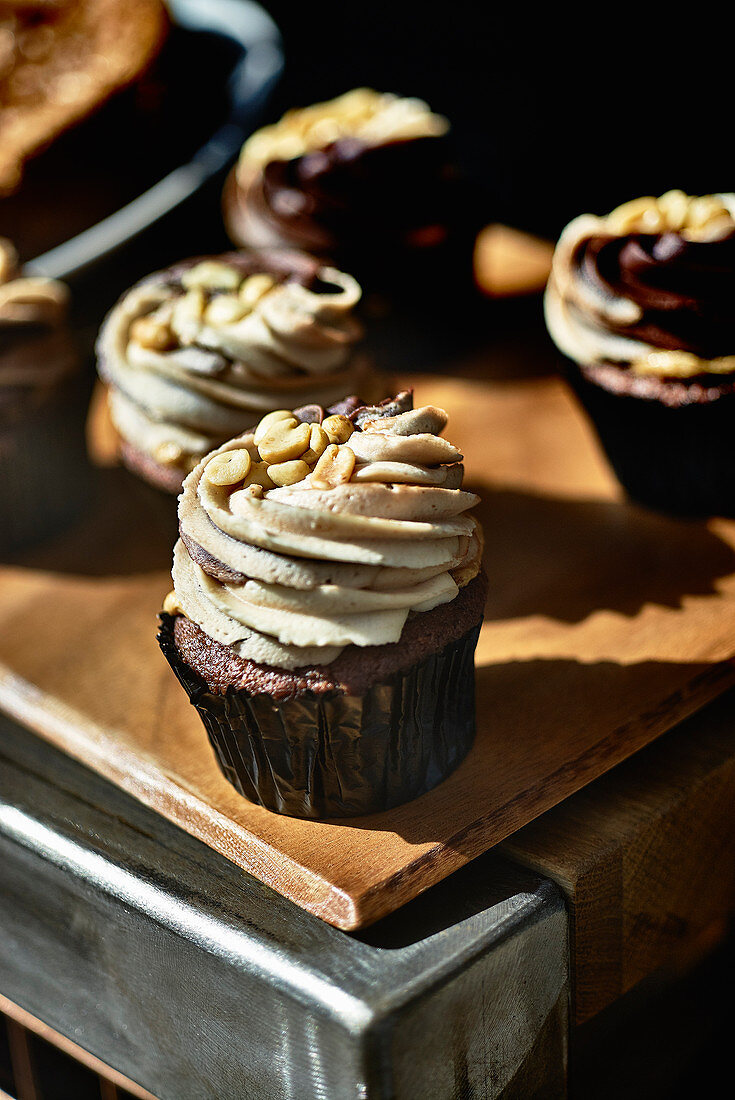 chocolate cupcakes with nut frosting to take away
