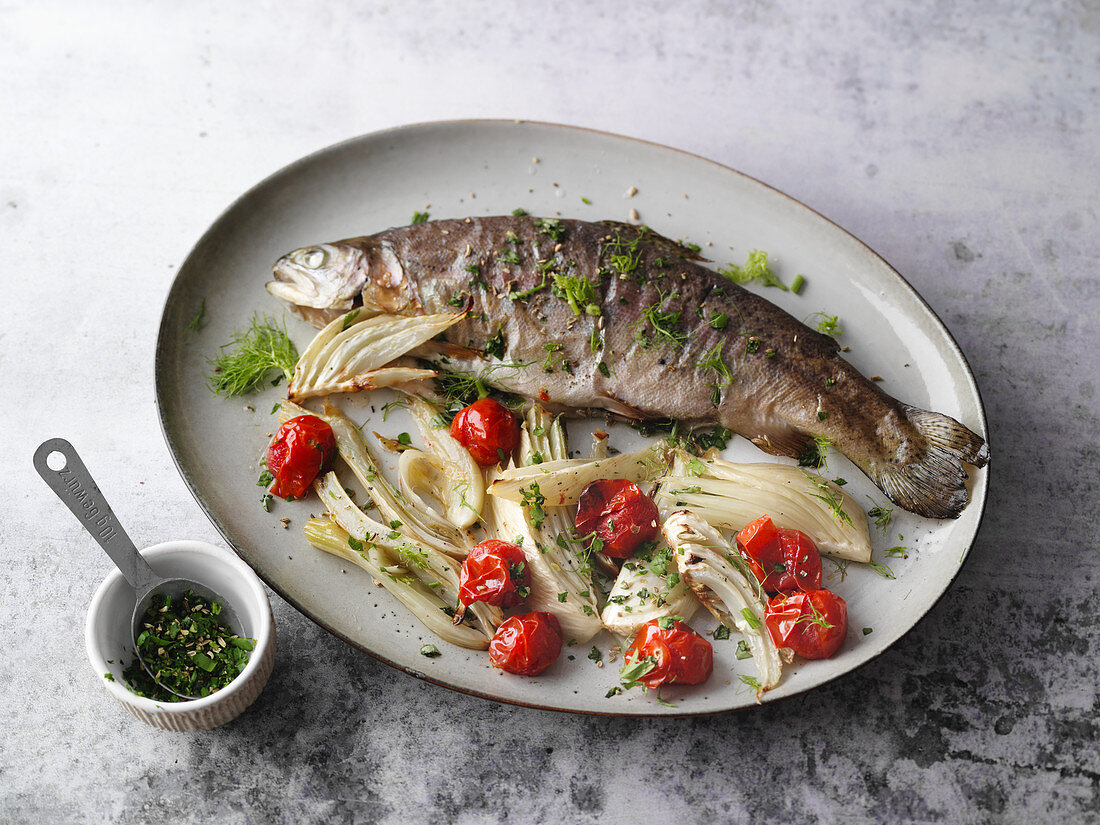 Oven-baked herb trout with fennel and cherry tomatoes