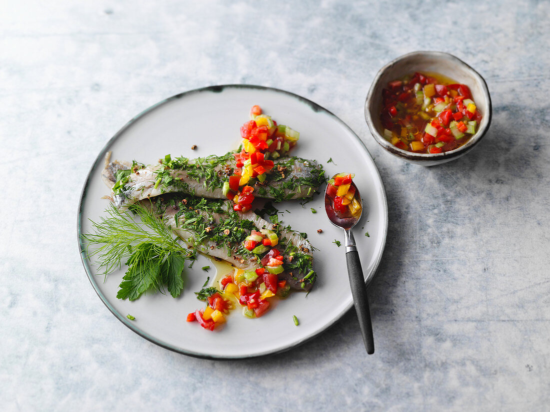 Herb soused herring with a spicy vegetable salsa