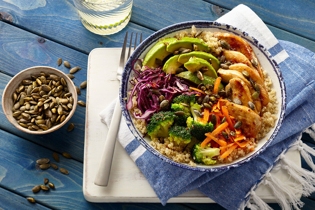 A Buddha bowl with garlic and honey chicken, vegetables and quinoa