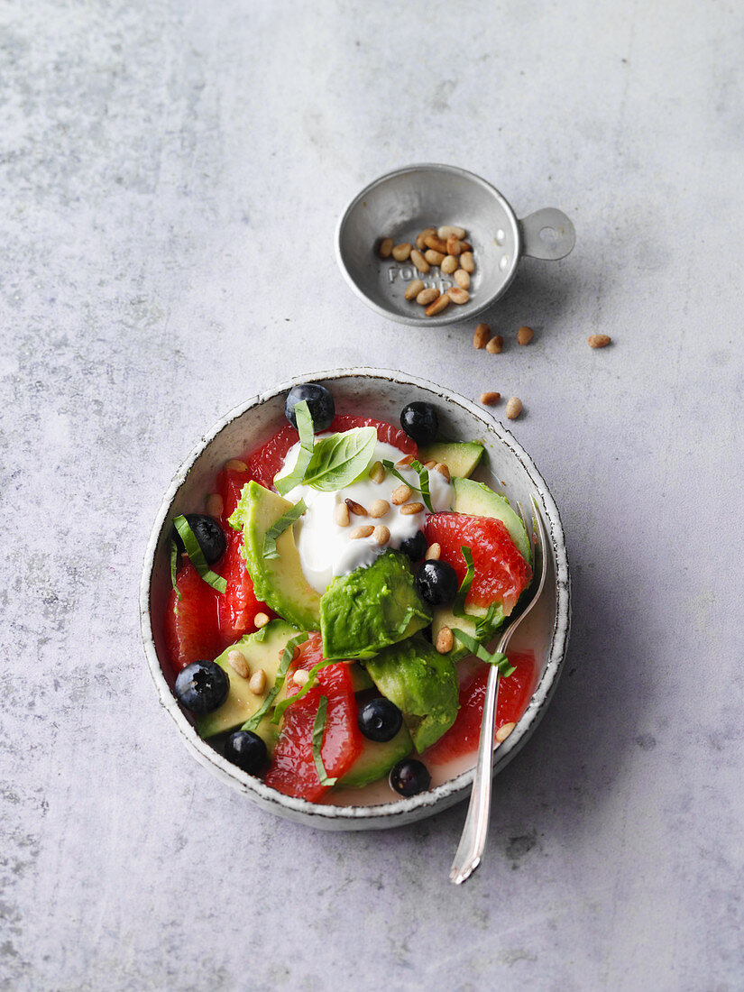Avocado and grapefruit salad with basil and blueberries