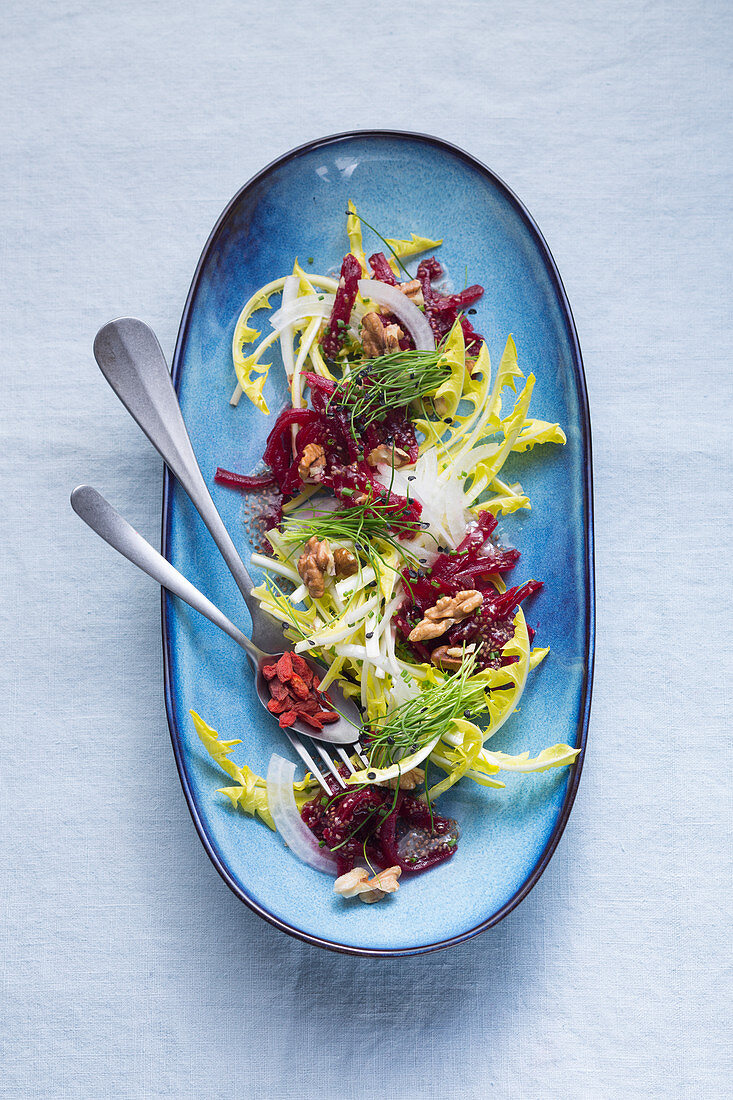 Yellow dandelion salad with beetroot and a chia dressing