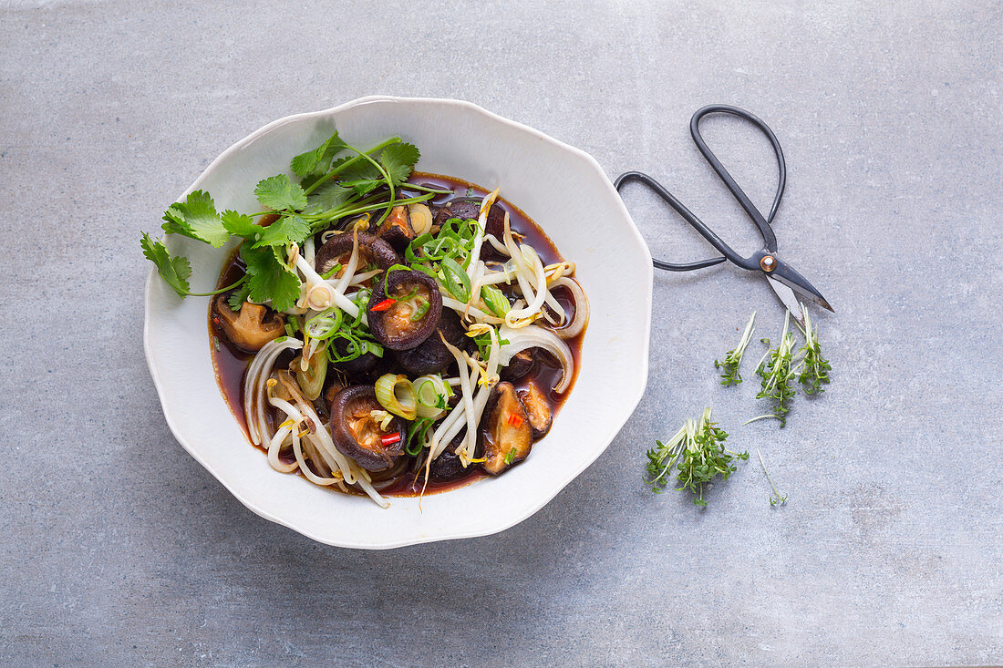 Shiitake mushrooms with mungbean sprouts in an Oriental broth