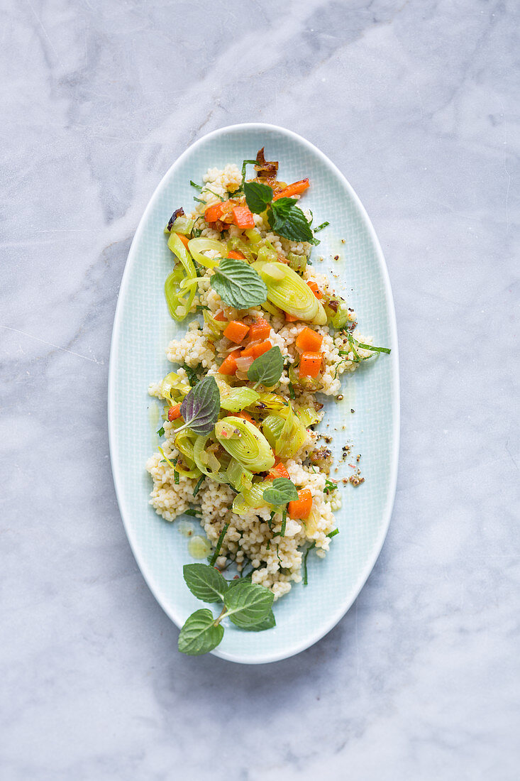 Millet couscous with braised vegetables and mint
