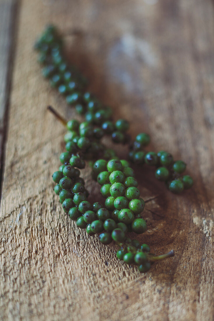 Bunches of green peppercorns