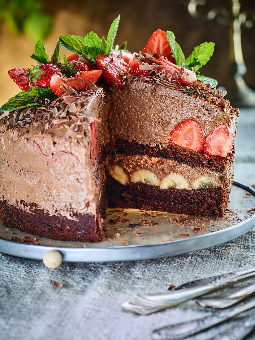 Chocolate mousse cake with strawberries and bananas